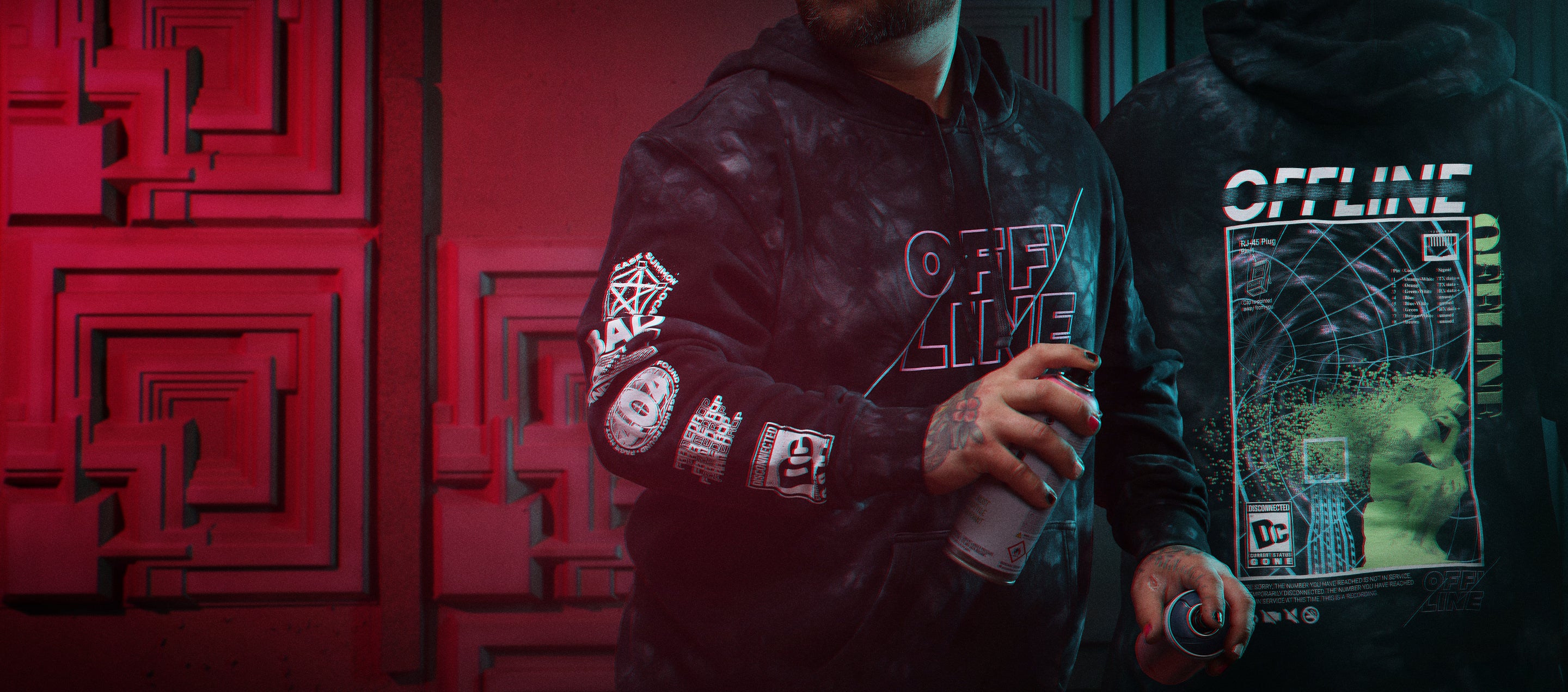 A person wearing a Offline Hooded Sweatshirt with a can of spray paint.