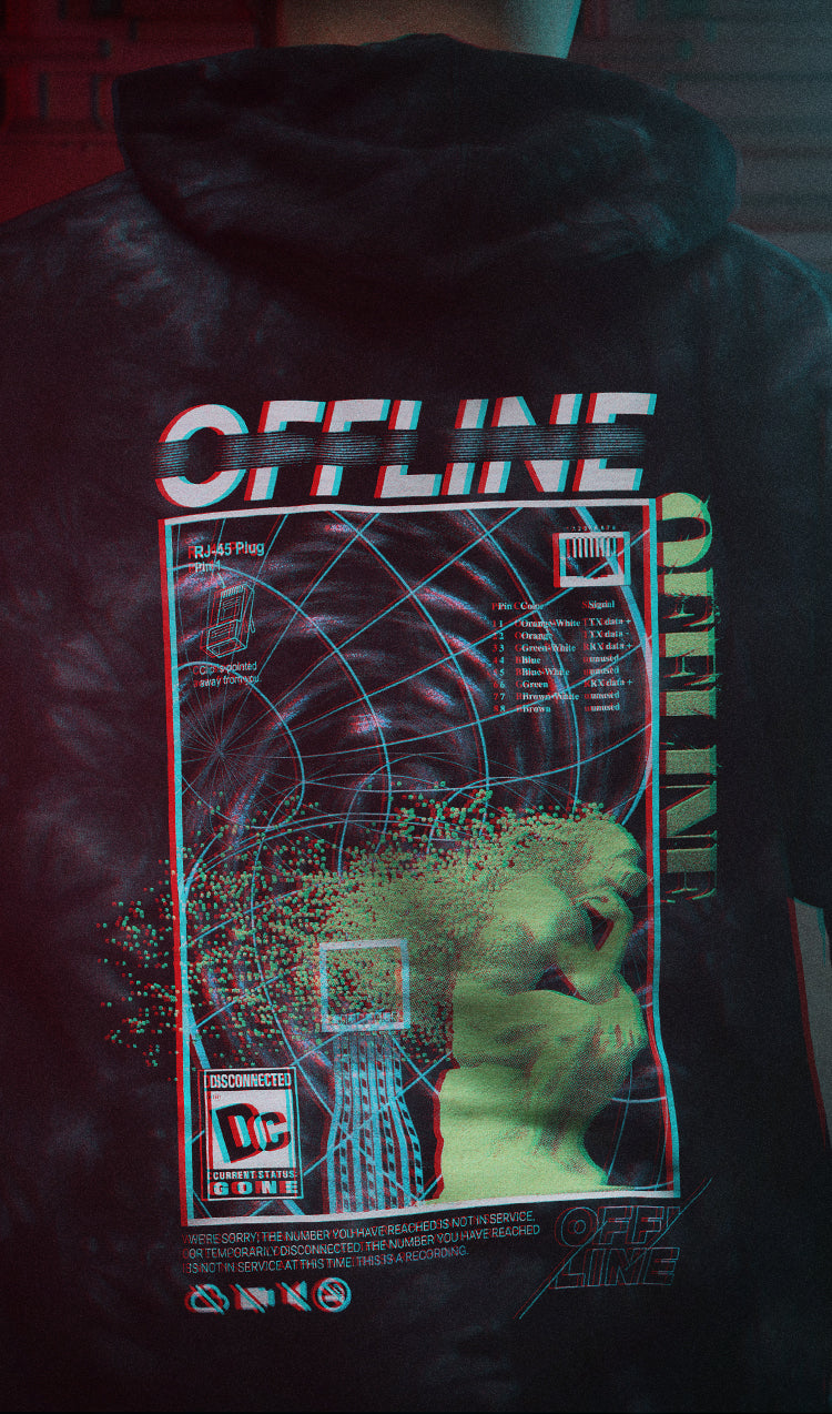 The back of a person wearing a Offline Hooded Sweatshirt with a can of spray paint.